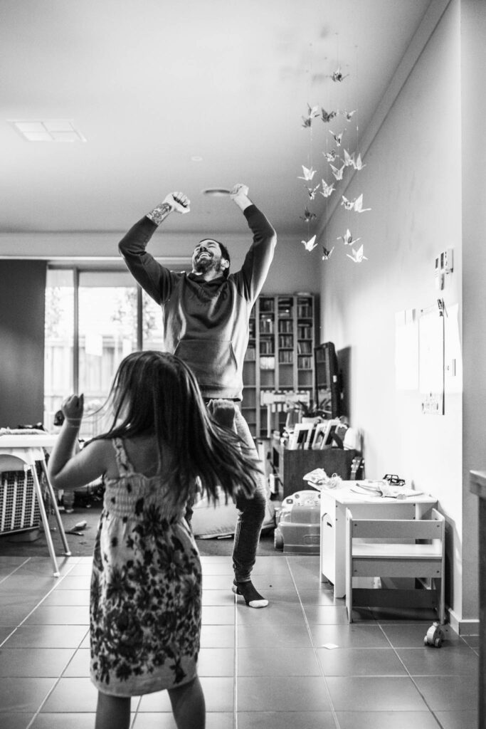 Girl dancing with her dad