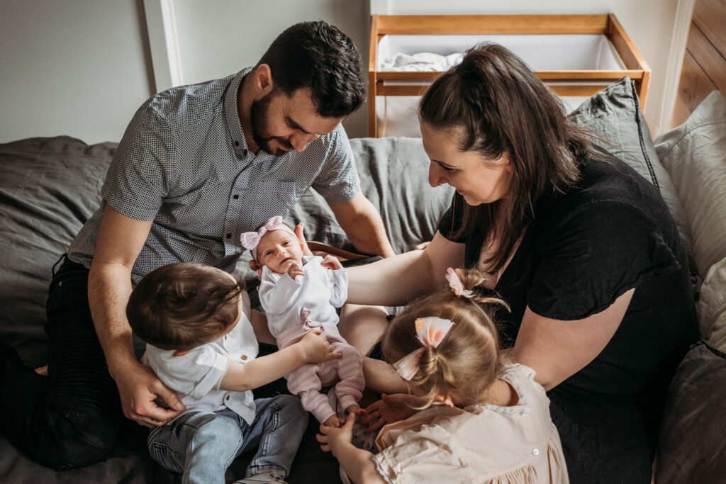 Newborn baby and family during an at-home photoshoot in the Macedon Ranges