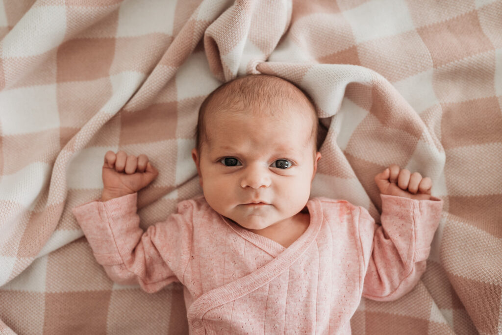 Family preparing for a newborn photoshoot at home