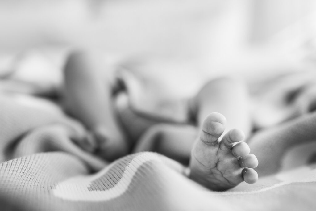 Newborn baby resting during a relaxed in-home photo session