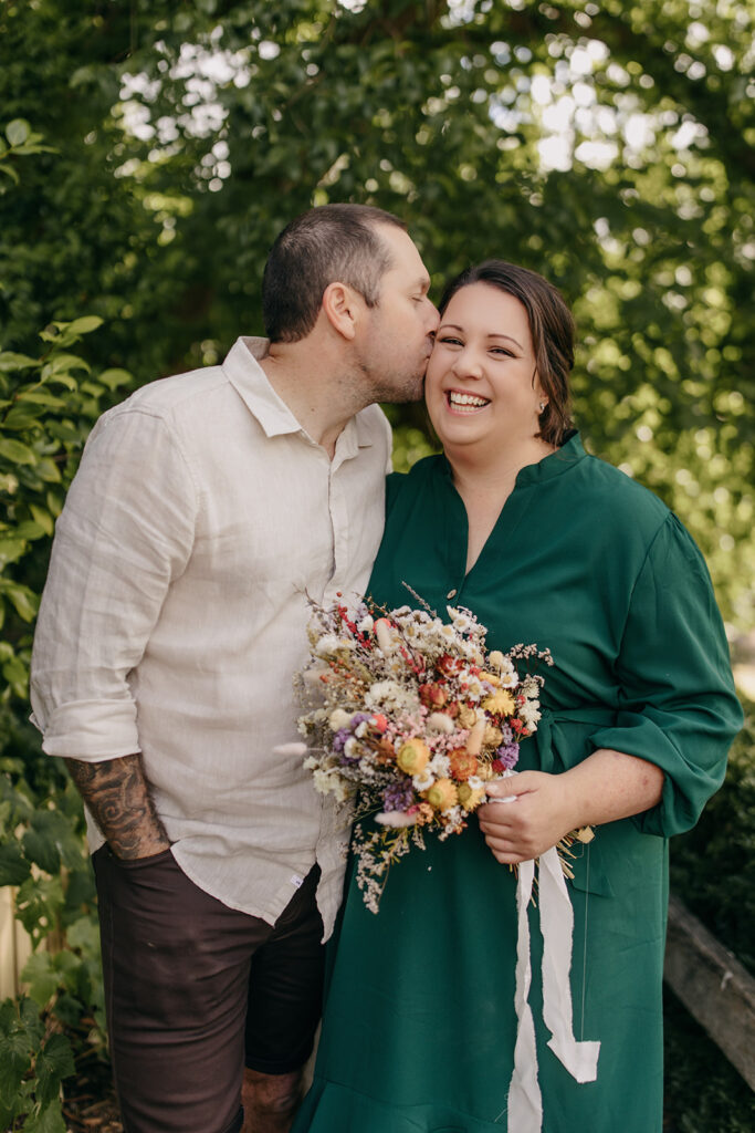 Bride ang groom embracing at their micro wedding in Melbourne