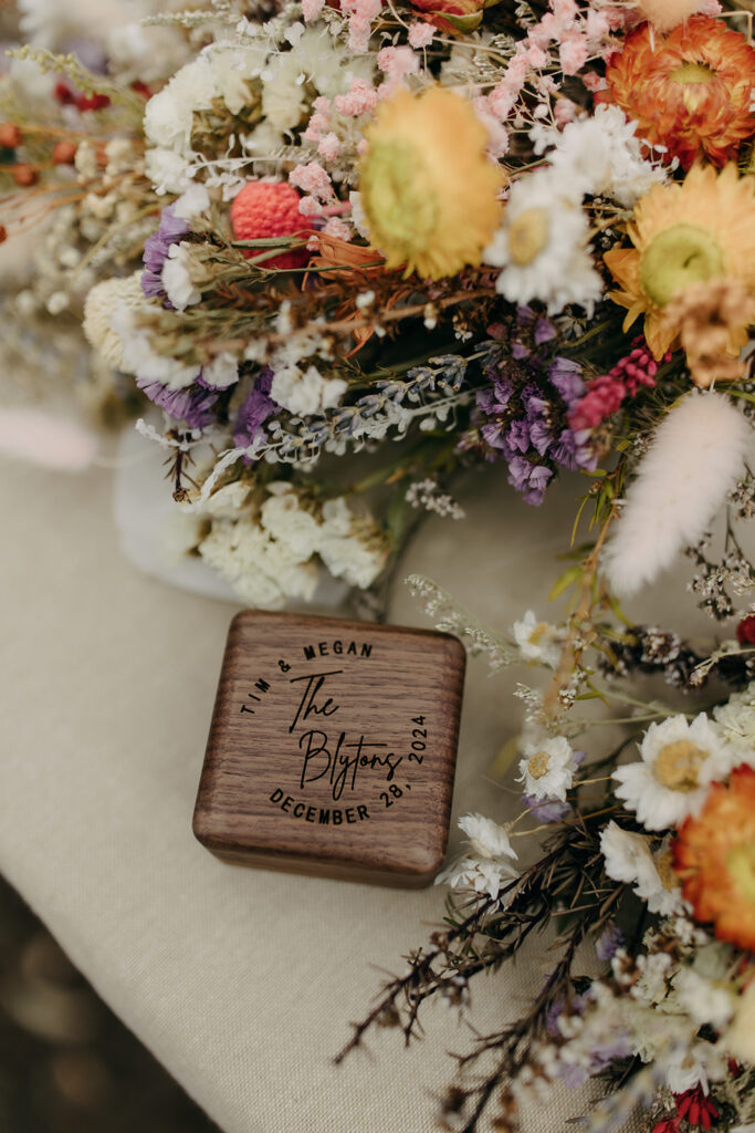 Ring box and flowers for micro wedding.