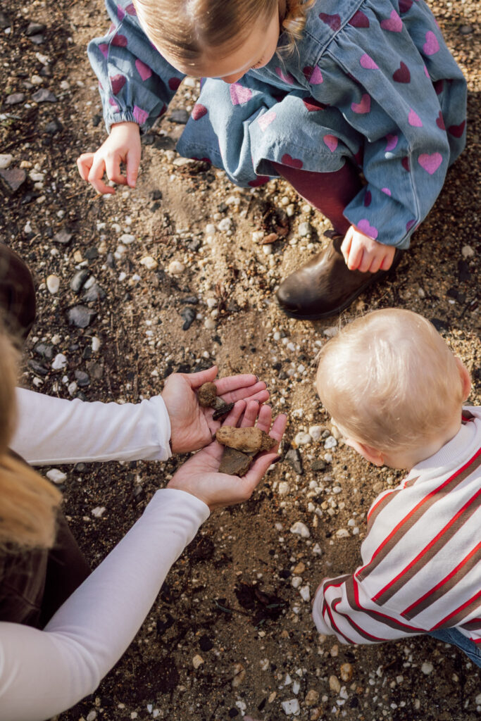 Picking up stones from the driveway.