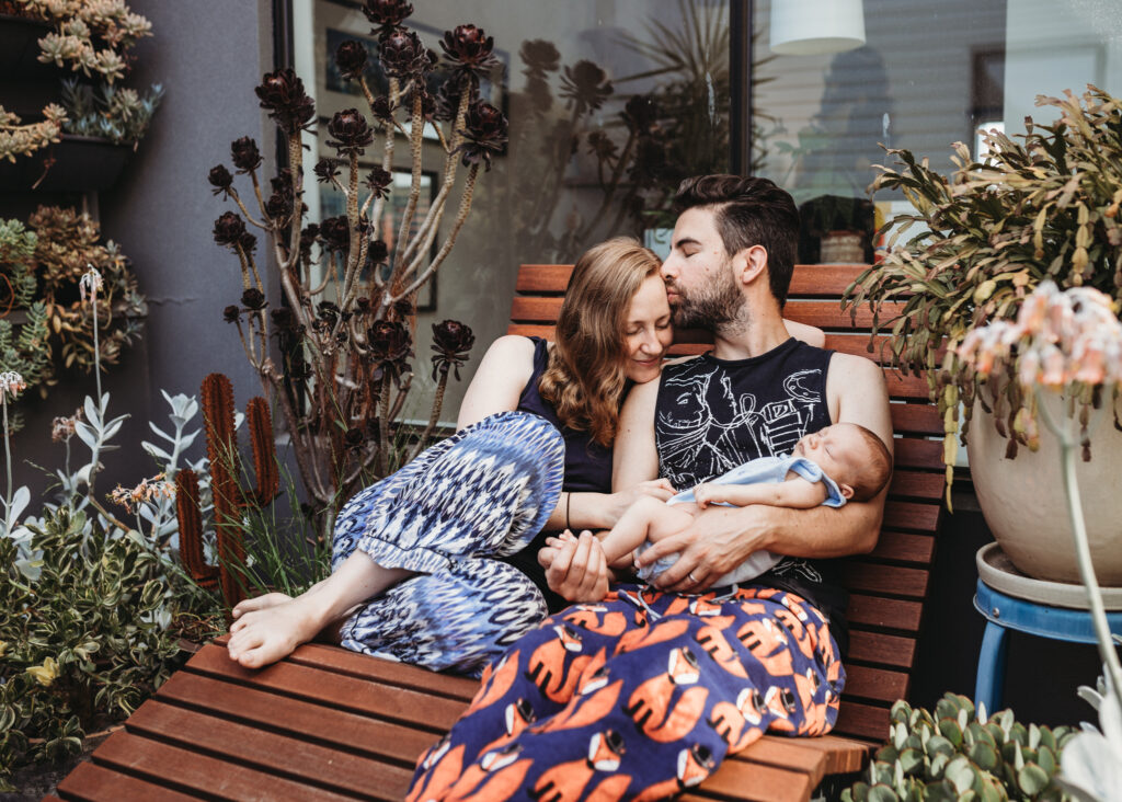 family decided to wear pyjamas for their family photoshoot as this is their norm as new parents